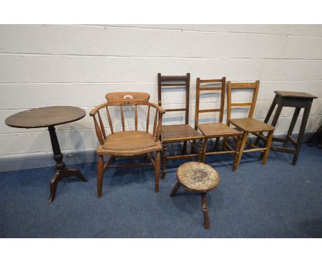 AN EARLY 20TH CENTURY ELM AND BEECH SMOKERS CHAIR, along with a Period pine high stool, carved milking stool, Georgian oak tr