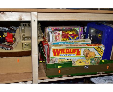 FOUR BOXES AND LOOSE CHILDRENS TOYS, GAMES, JIGSAWS etc, comprising of a green plastic trunk containing a castle and soldiers