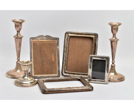 A SELECTION OF SILVER AND WHITE METAL ITEMS, to include a pair of tapered stem candlesticks, on round weighted bases, each ha