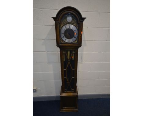 AN OAK LONGCASE CLOCK, with an arched hood, glazed door enclosing an 8.5 ins dial, Tempus Fugit to arch, spandrels surroundin