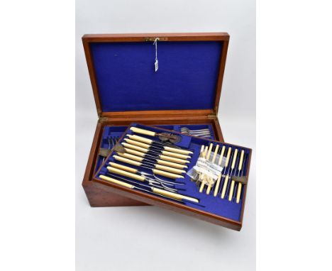 A COMPLETE CANTEEEN OF CUTLERY, wooden canteen with brass inlayed handles, opens to reveal three levels, filled with EPNS cut