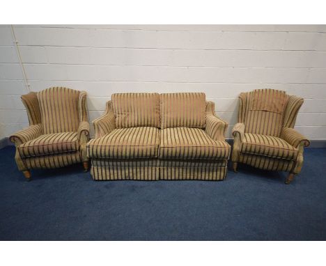 A DURESTA STYLE THREE PIECE LOUNGE SUITE, stripped red and gold upholstery, comprising a sofa, length 170cm and a pair of win