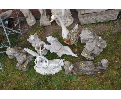 SEVEN SMALL GARDEN FIGURES including a pair of composite Art Nouveau style busts of a lady holding a book 47cm high, a compos