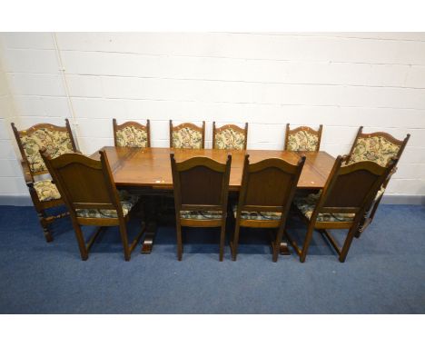 AN OLD CHARM OAK DRAW LEAF DINING TABLE, extended length 259cm x closed length 183cm x depth 92cm x height 79cm and ten chair