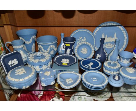 A COLLECTION OF WEDGWOOD JASPERWARE IN PALE BLUE AND PORTLAND BLUE, including bud vases, six trinket boxes and covers, pin di