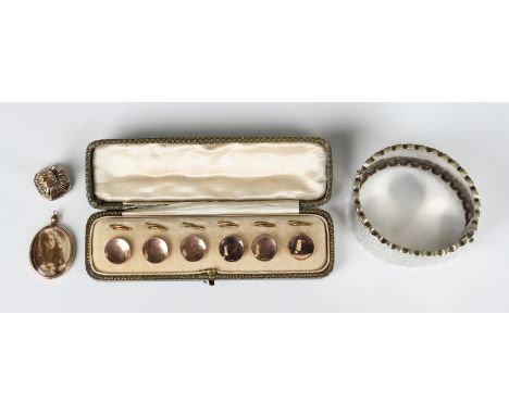 A set of six gold mounted circular buttons with dished fronts, detailed '9ct', weight 8.3g, with the original split ring fitt