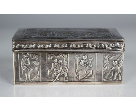A late 19th century Dutch silver rectangular box, the hinged lid and sides decorated in relief with classical figures, putti 