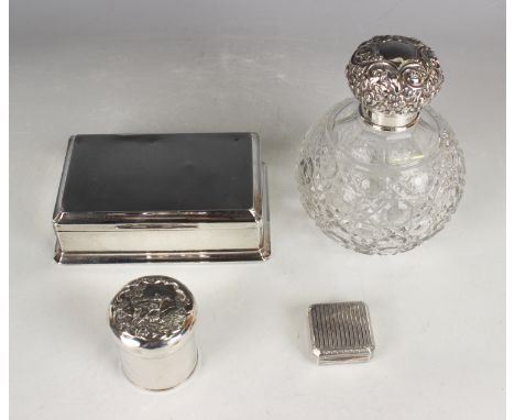A late Victorian silver cylindrical jar and cover, the cover embossed with an idyllic country scene of a shepherdess and shee