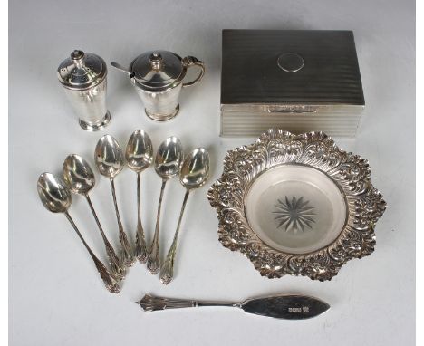A late Victorian silver circular petal rimmed butter dish, decorated in relief with foliate scrolls, and a matching Albany pa