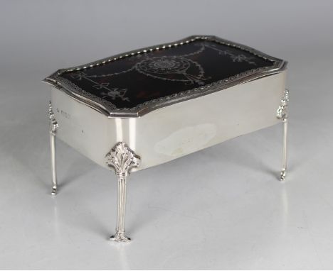 An Edwardian silver and tortoiseshell rectangular trinket box, the hinged lid piqué inlaid with bellflower garlands, ribbons 