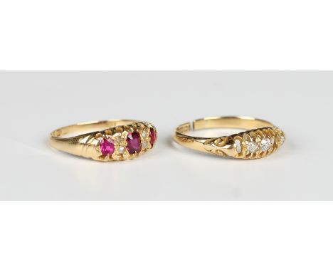 An 18ct gold, ruby and diamond ring, mounted with three oval cut rubies and two pairs of diamonds at intervals, Chester 1913,