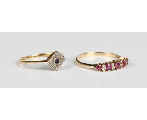 A 9ct gold, ruby and diamond ring, mounted with a row of five circular cut rubies with four pairs of circular cut diamonds at