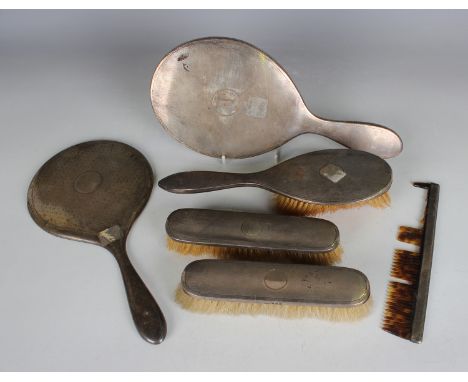 A small group of silver backed dressing table items, comprising two hand mirrors, hairbrush, two clothes brushes and comb (fa