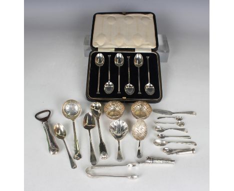 A small group of silver items, including a set of six coffee spoons, Sheffield 1932, cased, two caddy spoons, a child's whist