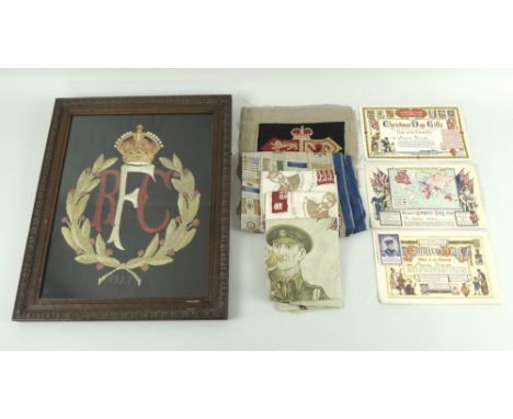 A group of WWI home front items, comprising a needlepoint for the Royal Flying Corps dated 1917, embroidered piece 27 by 34.5