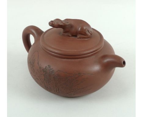 A Chinese Yixing stoneware teapot and cover, late Qing / Republic period, of compressed globular form, the cover with water b