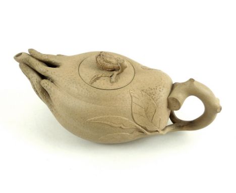 A Chinese Yixing stoneware teapot and cover, late Qing / Republic period, formed as a mandrake root, the branch form handle c