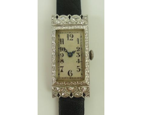 An Art Deco Wheeler 18K white gold and diamond set manual wind cocktail watch, circa 1920's, of tank form with lunette shapes