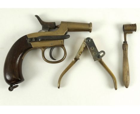 A brass Naval signals pistol, with ring butt cap, 18cm, together with a brass bullet mould, 12.5cm, and a French powder and s