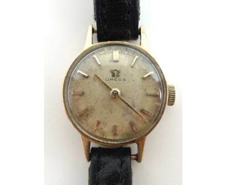 An Omega 9ct gold cased lady's wristwatch, circular pearlised dial with gold batons and gold arrow hands, cal 483, serial 201