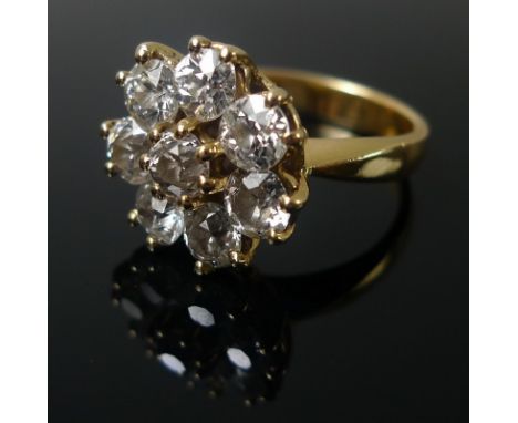 An 18ct gold and diamond dress ring, formed of eight old cut diamonds in a cluster design, claw set, total diamond weight app