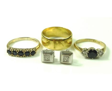 A group of gold jewellery, comprising a 22ct gold wedding band, size K/L, 5.6g, an 18ct gold ring set with two diamonds, each