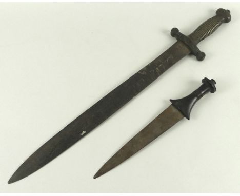 An 19th century copy of a Roman gladius, ribbed brass handle, blade 48cm, overall 63.5cm, together with a North African dagge