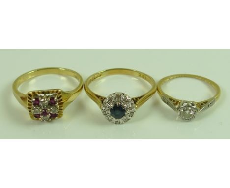 A group of three 18ct gold rings, comprising an 18ct gold, platinum and diamond solitaire ring, the diamond of approximately 