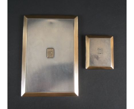 A George V Asprey silver cigarette case with a raised gold monogram and gilded border, engine turned finish, London 1927, Asp