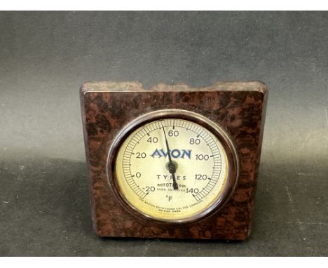 An Avon Tyres branded bakelite desktop thermometer.