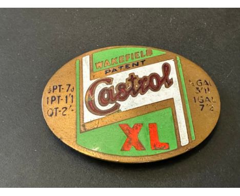 A Castrol XL enamel on brass oval price tag.