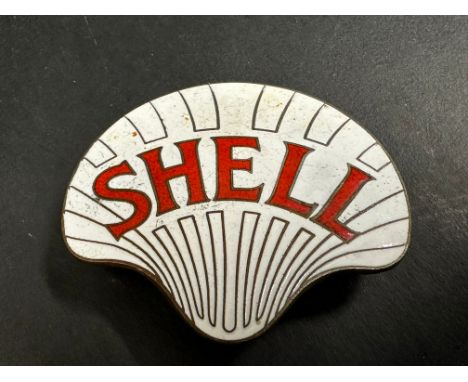 A Shell enamel cap badge by Gaunt.
