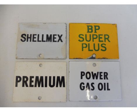 Four enamel petrol pump brand indicator plaques including BP Super Plus and Power Gas Oil.