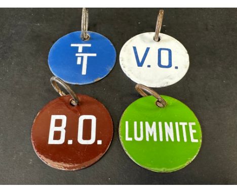 Four enamel bulk tank tags, TT, V.O., B.O. and Luminite.