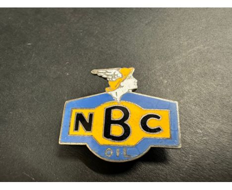An NBC Oil enamel lapel badge by Gaunt.