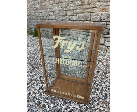 A counter top display cabinet with rear opening door and two glass shelves, later lettering to the front, 18" w x 29" h x 12 