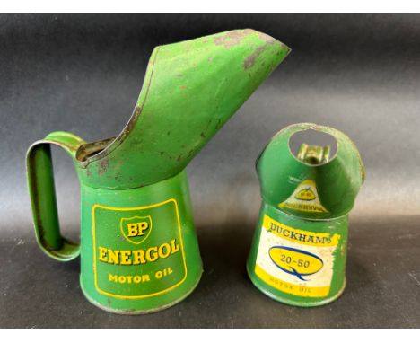 A BP Energol Motor Oil pint measure dated 1956 and a Duckhams 20-50 half pint measure dated 1965.