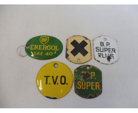 A quantity of enamel petrol pump/bulk tank brand indicator plaques including BP Energol, BP Super Plus, T.V.O. etc.