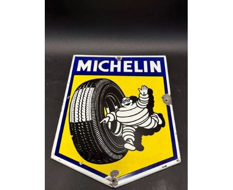 A small Michelin enamel sign depicting Mr. Bibendum rolling a tyre, 12 1/2 x 16 1/2".