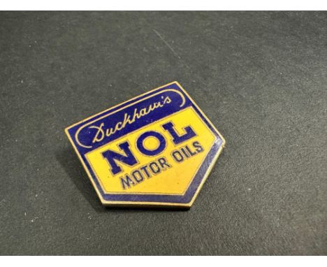A Duckham's NOL Motor Oils enamel lapel badge by Marples &amp; Beasley.