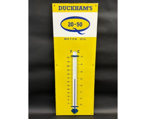 A Duckham's 20-50 Motor Oil enamel thermometer in excellent condition, 13 x 36".