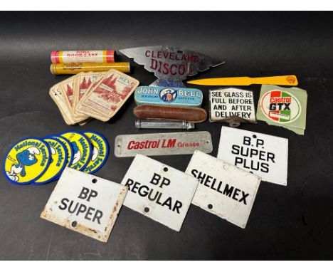 A selection of motoring collectables including four enamel petrol pump brand inserts.
