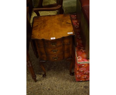 MODERN WALNUT SIDE TABLE WITH TWO DROP LEAVES AND THREE SHAPED DRAWERS RAISED ON PAD FEET