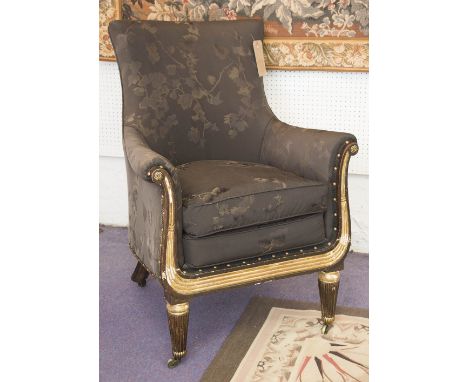 LIBRARY ARMCHAIR, Regency simulated rosewood and parcel gilt in the manner of Henry Holland with black leaf patterned upholst