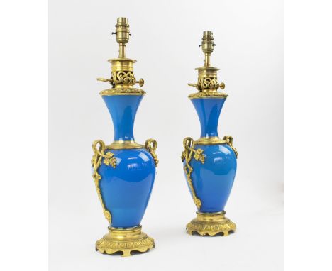 TABLE LAMPS, a pair, late 19th century French blue ceramic and ormulu mounted converted from oil lamps, 41cm H, plus shades. 