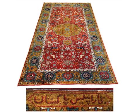 EXTREMELY FINE SIGNED ISPHAHAN RUG, 267cm x 145cm pendant medallion on a hunting design terracotta field within complimentary