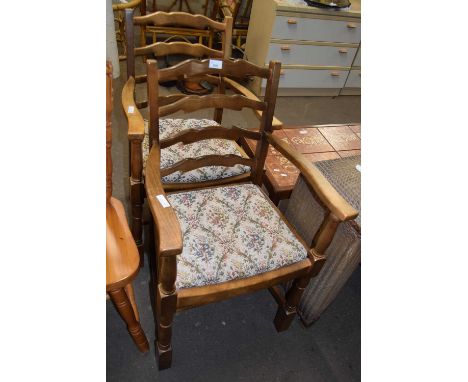 A PAIR OF LADDER BACK CARVER CHAIRS