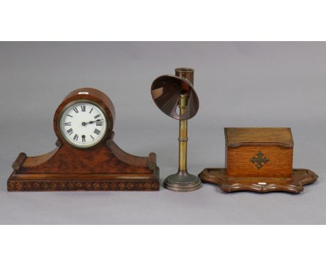 An early 20th century mantle clock with black roman numerals to the 5½” diameter white enamel dial, 12” high; together with a