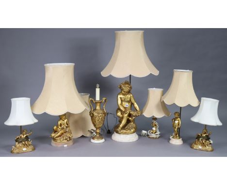 Seven continental-style table lamp bases, each with shade.