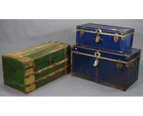 A domed-top travelling trunk, 38¾" wide x 19¼" high; together with two other travelling trunks.